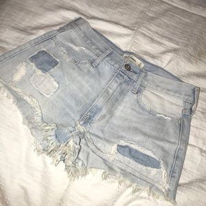 Light wash, ripped jean shorts.